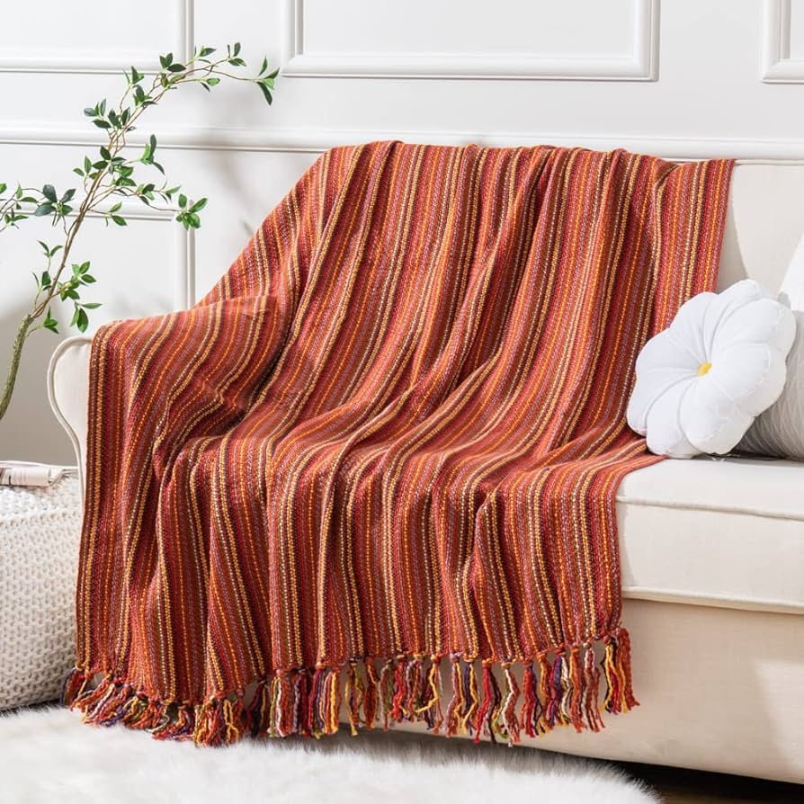 sofa decorated with blanket