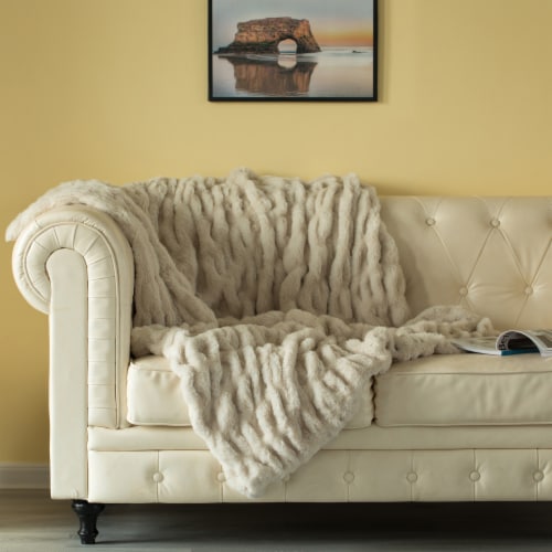 sofa decorated with blanket