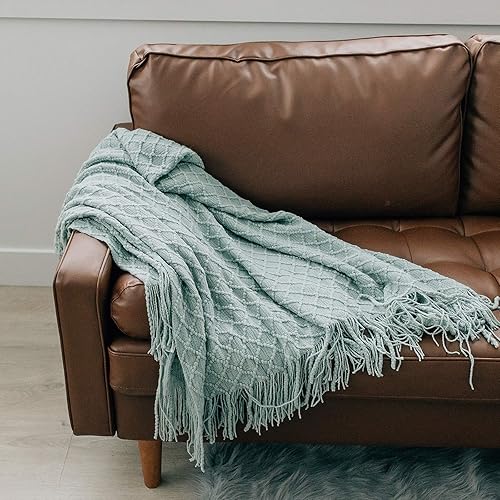 sofa decorated with blanket